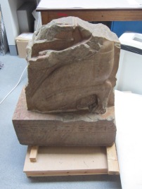 An reddish coloured marble statue, as it appeared before steam cleaning