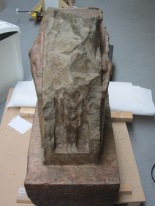 Reddish coloured marble statue as it appeared before steam cleaning
